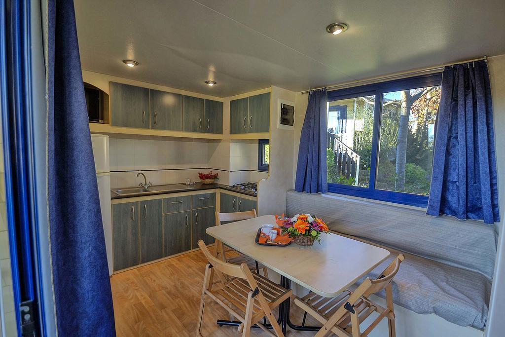 Budget Two-Bedroom Bungalow with Kitchenette and Patio,165907413:JPEG