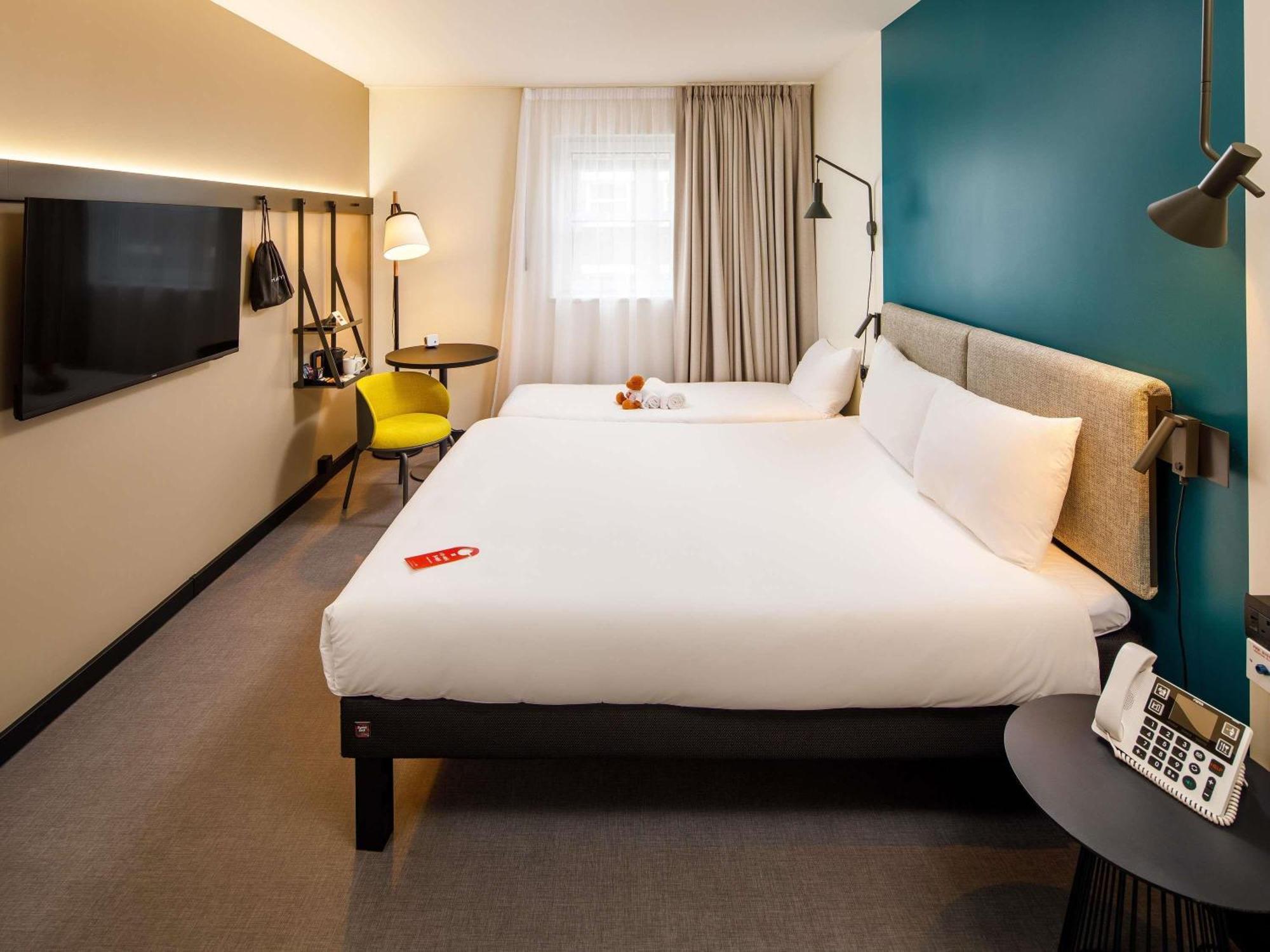 family room with one double and one single bed