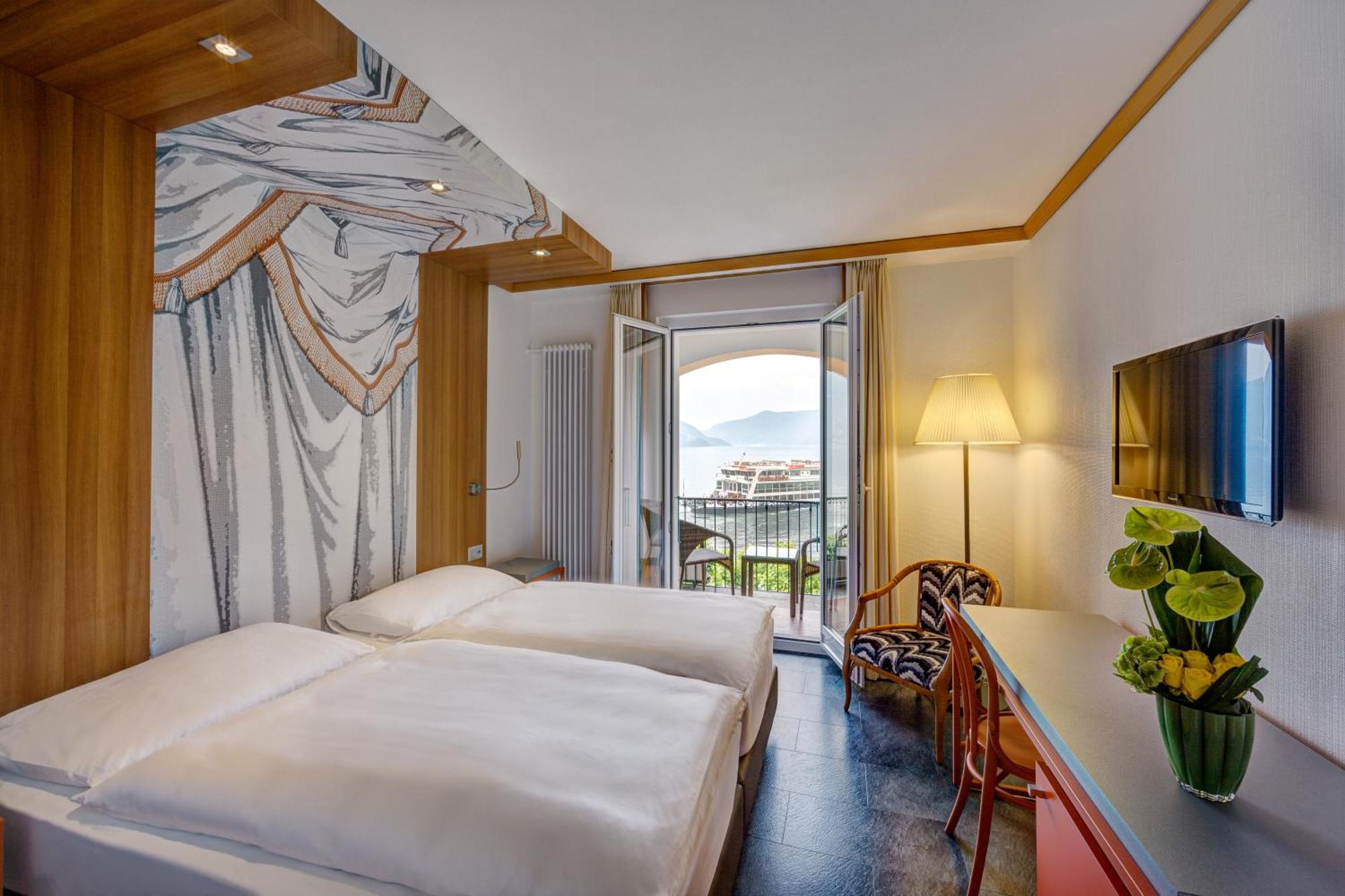 Zweibettzimmer mit Terrasse und Seeblick
