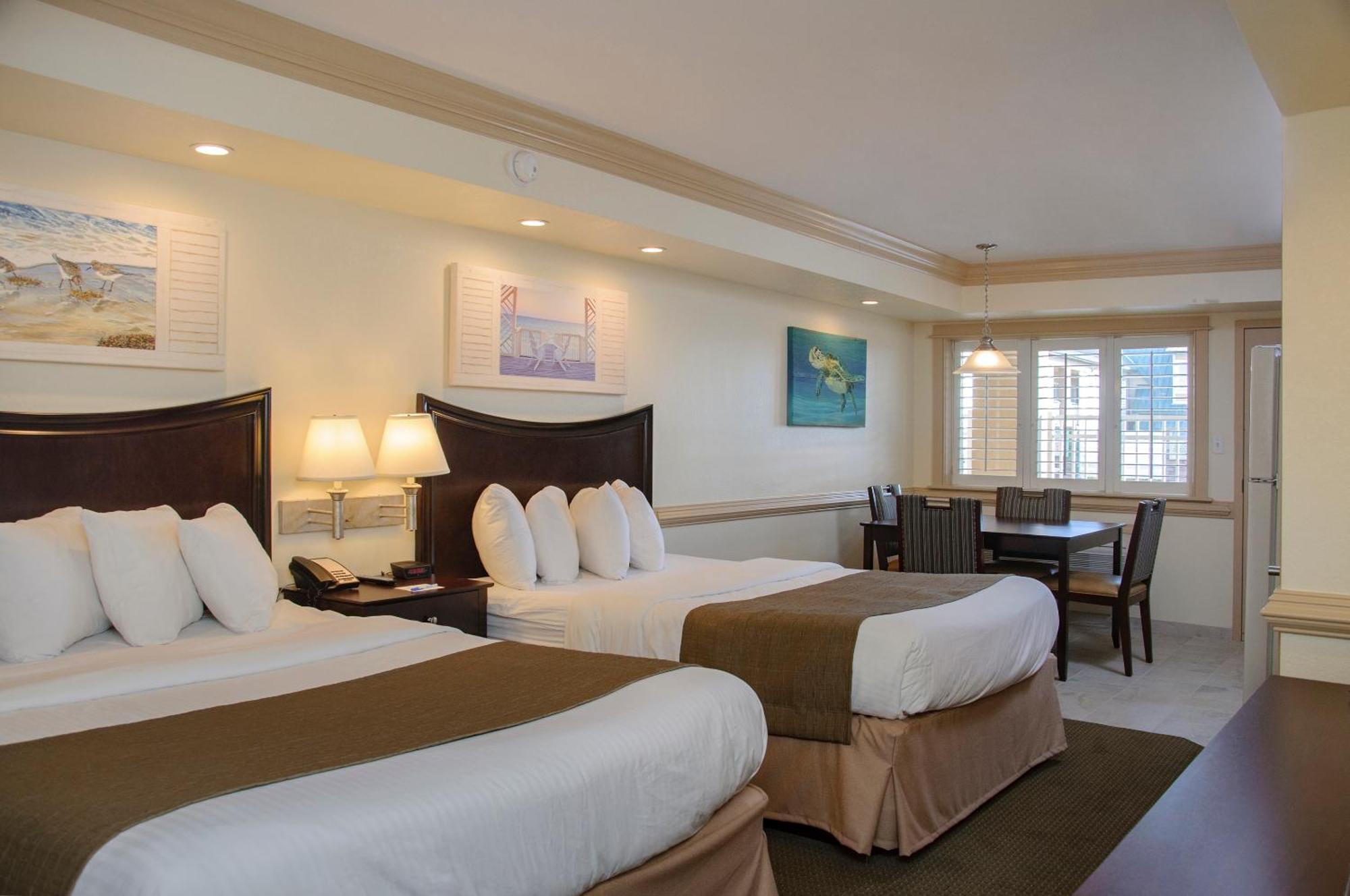 Efficiency Two Queen Beds Main Building & Pool View,703439587:JPEG